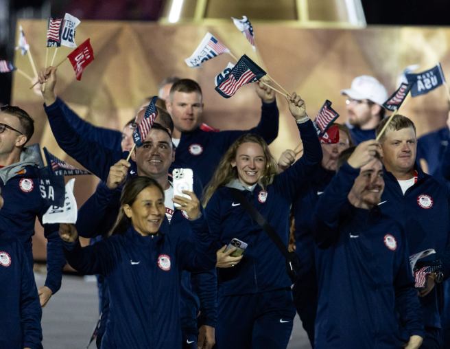 Members of Team USA holding flags at the olympics